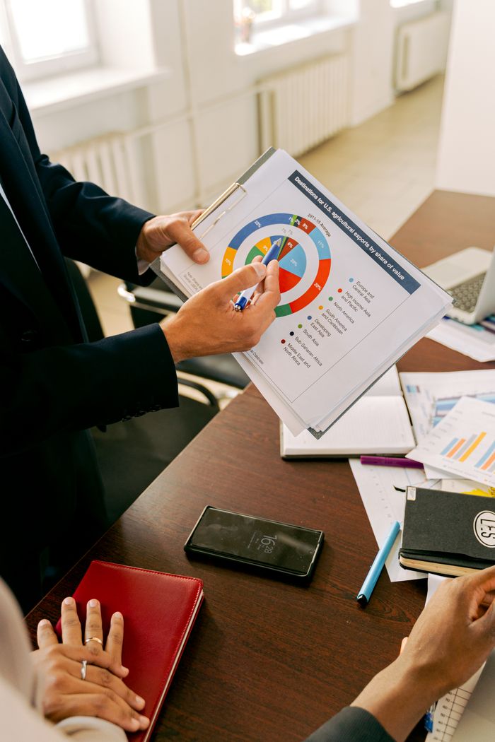 creative-03 Business professionals discussing financial charts during a strategy meeting.
